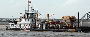 USCGC Obion, a river buoy tender, maintaining navigational buoys on the Ohio River at Louisville, Kentucky. UnitedStatesCoastGuardCutterOBION.jpg