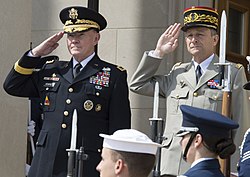 United States General Martin Dempsey and French General Pierre de Villiers saluting (23 April 2014, cropped).jpg