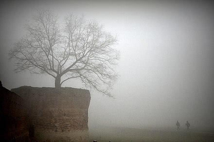 Walls of Ferrara shrouded in heavy fog
