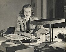 Jane P. Metzger, a review officer for the War Labor Board, sitting at her desk at the Region V offices in Cleveland, Ohio, in late 1944 or 1945. Metzger would subsequently engage in scholarly research regarding the social and public impact of the post-war wave of strikes. War Labor Board review officer 1945.jpg