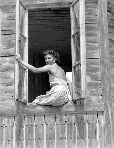 File:Wooden cottage, portrait, woman, sunshine, window Fortepan 705.jpg