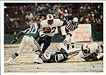 Simpson pictured in the game where he became the first running back to gain over 2,000 yards in a season on Dec. 16, 1973. 1986 Jeno's Pizza - 29 - O.J. Simpson.jpg