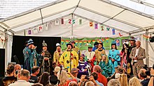 2022 Lord Mayor Phil Thomas being revealed on stage with previous Lord Mayors behind at the 25th Anniversary of Polperro Festival 25th Anniversary Festival.jpg