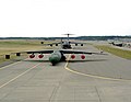 A C-141B Starlifter and a C-5 Galaxy, U.S. Air Force transport aircraft, are exhibited on a runway at the naval station's air show. Exact Date Shot Unknown - DPLA - 2dffe0d127be13fee6928bd927fda658.jpeg