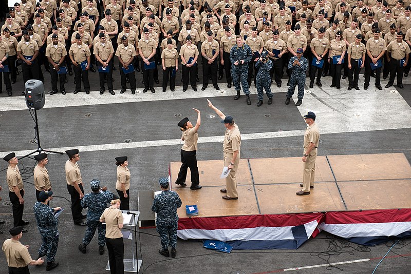 File:A newly frocked petty officer reaches to high five CMC Spike Call during a frocking ceremony. (34991313286).jpg
