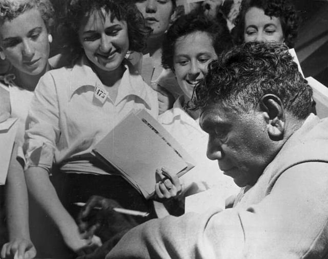 Namatjira signing autographs, c. 1950