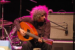 Hakim Hamadouche playing a 10 string electric mondole in Marseilles.