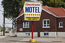 A motel on Kingston Road. The road developed as a motel strip in the 1950s, with a number of motels remaining in operation today. August 2012 Scarborough Kingston Road Americana Motel (7714380340).jpg