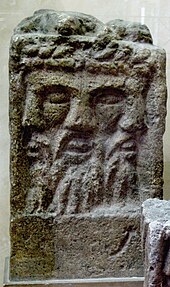 Altar depicting a three-faced god identified as Lugus, discovered in Reims. Autel tricephale MuseeStRemi Reims 1131a.jpg