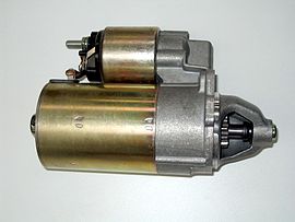 An automobile starter motor (larger cylinder). The smaller object on top is a starter solenoid which controls power to the starter motor and engages the Bendix drive. Automobile starter.JPG