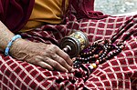 Bhutanese tartan (mathra) dress (gira) featuring "X" patterns where the white stripes meet, produced by supplementary weaving