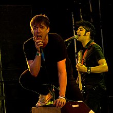 It wasn't until the recording of Watoosh! that Kowalewicz (left) and D'Sa started singing, "creating unique harmonies accented by the loud rock sound that the band was pumping out." Billy Talent at Ruisrock.jpg