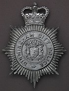 Hat badge of the type in use on the last day of the service
