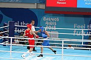 Deutsch: Boxen bei den Olympischen Jugendspielen 2018 Tag 12, 18. Oktober 2018 - Kampf um Bronze im Leichten Weltergewicht Jungen – Hassan Azim (Großbritannien, rot) schlägt Mohammed Boulaouja (Marokko, blau) RSC; Ringrichter ist Wulfren Olivares Peréz (Kolumbien). English: Boxing at the 2018 Summer Youth Olympics on 18 October 2018 – Bronze Medail Match Light Welterweight Boys - Hassan Azim (Great Britain, red) beats Mohammed Boulaouja (Morocco, blue) RSC; Referee is Wulfren Olivares Peréz (Columbia). Español: Boxeo en los Juegos Olímpicos Juveniles de Verano de 2018 en 18 de octubre de 2018 - Medalla de bronce de los hombres ligeros de peso welter: Hassan Azim (Gran Bretaña, rojo) vence a Mohammed Boulaouja (Marruecos, azul) RSC; El árbitro es Wulfren Olivares Peréz (Colombia).