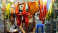 A stall inside the food court selling cuts of either duck or pork, served either with rice or in noodle soup