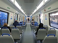 Passengers aboard a Roca Line train. CSR Roca interior 1.jpg