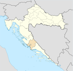 Шибенско-книнската Жупанија (портокалова боја) во Хрватска (жолта боја)
