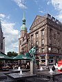 Dortmund, fountain (die Bläserbrunnen), the pharmacy (die Adler Apotheke) and churchtower (die Reinoldikirche)