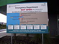 Sign explains that the emergency department is not yet open, and gives details of nearby emergency hospitals.