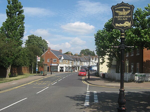 Farnborough High Street with its village sign