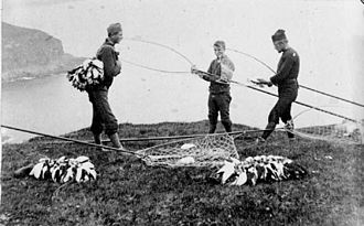 Faroese fleygers with their catch, late 19th century Fleygamenn Trongisvagur.jpg