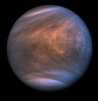 The atmosphere of Venus appears darker and lined with shadows. The shadows trace the prevailing wind direction.