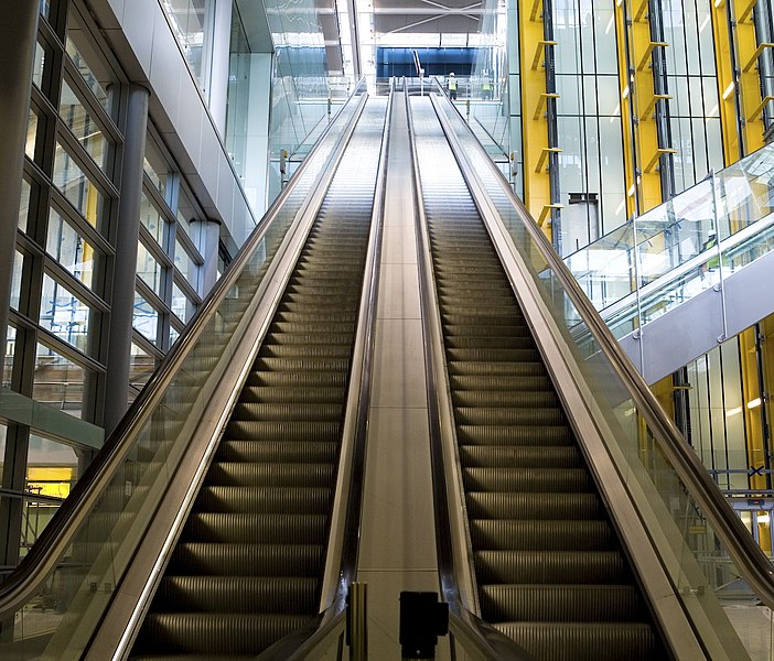 File:Heathrow Terminal 5 - Escalator down to Track Transit System (2307578958).jpg