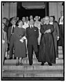 The Italian Ambassador and Senora Fulvia Suvich leaving Holy Rosary Catholic Church after attending a requiem mass in honor of Guglielmo Marconi in 1936.