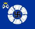 The colour of the Karelian Air Command features, like all Finnish Air Force colours, a swastika within a winged circle. The identifying device is a small coat of arms of Karelia