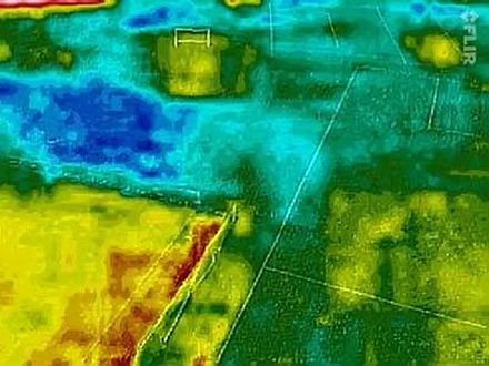 Kite aerial thermogram revealing features on/under a grassed playing field. Thermal inertia and differential transpiration/evaporation are involved. (https://www.facebook.com/KARSensing/)