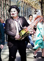 Cosplayer dressed as the cannibal Leatherface with his characteristic chainsaw (2015) Leatherface cosplay.jpg