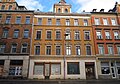 Apartment building in closed development and shop