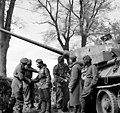 Men of the British 6th Airborne Division greet the crew of a Soviet T-34-85 tank during the link-up of British and Soviet forces near Wismar on the Baltic coast, 3 May 1945.