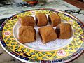 Lyu Da Gun (bite-sized rice cakes with red bean paste filling, covered in roasted soybean flour)