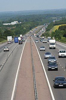 busy six lane highway crossing rural hilly landscape