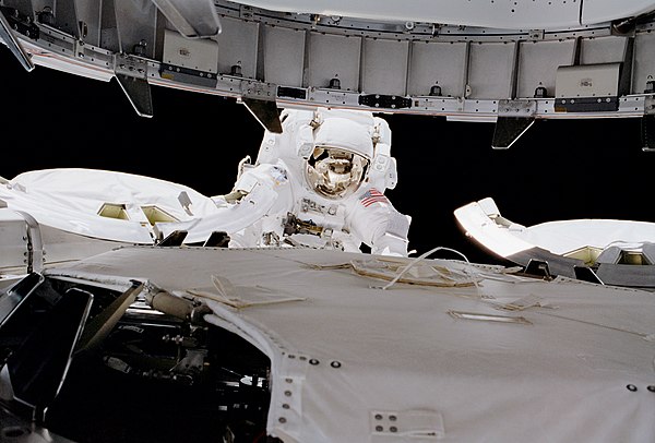 Wisoff oversees the Z1 truss (top) being mated with the zenith port of Unity (bottom) during EVA 2