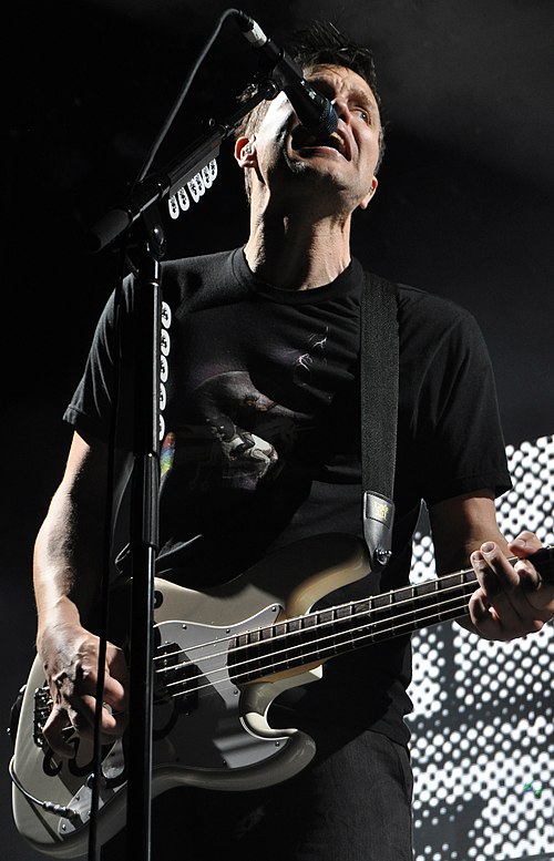 Hoppus performing with Blink-182 in 2011