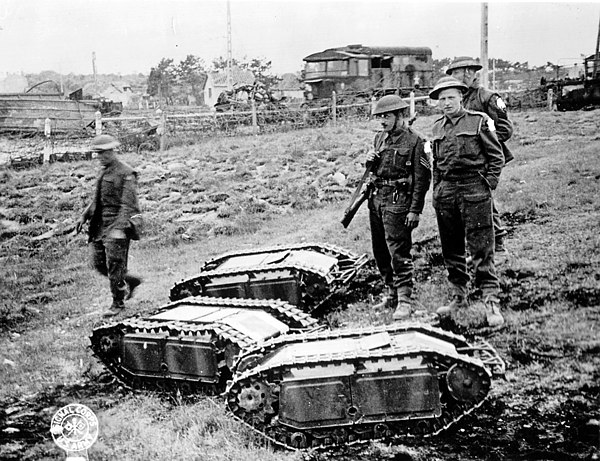 British soldiers with captured German Goliath remote-controlled demolition vehicles (Battle of Normandy, 1944)