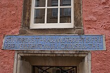 Motto 'Sen vord is thrall' on front of Abbot House Motto 'Sen Vord Is Thrall' on Abbot House Dunfermline.JPG