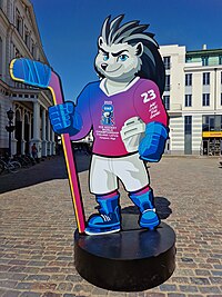 Games mascot Spiky sits on the goal before the 2023 IIHF Ice