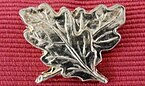 OBE silver oak-leaf emblem for gallantry Order of the British Empire for gallantry, oak leaves ribbon emblem.jpg