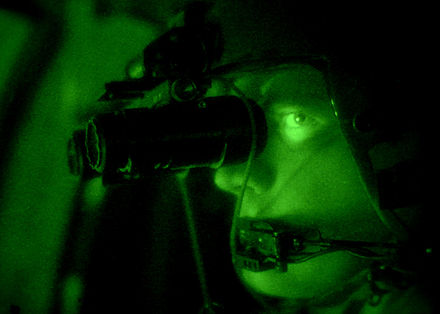 A U.S. Army aviator uses a pair of helmet-mounted AN/AVS-6 vision goggles. The effect on the natural night vision of the eye is evident PEO ANAVS-6 NVG.jpg