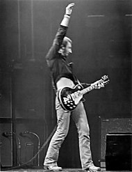 The Who's Peter Townshend often used a theatrical "windmill" strum to play "power chords"--a root, fifth, and octave. Pete Townshend Windmill-(jha).jpg