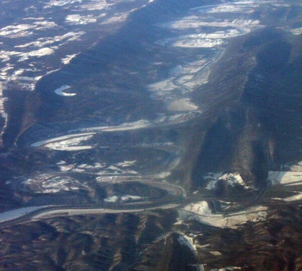 Oblique air photo of the confluence of the North and South Branches near Green Spring, West Virginia. Facing southwest. River Mountain is on the right