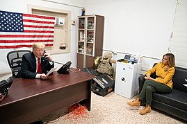 President Trump, joined by First Lady Melania Trump, speaks on the phone with Iraqi Prime Minister Abdul-Mahdi, Dec. 26, 2018, during his visit to Al Asad Airbase. President Trump the First Lady Visit Troops in Iraq (46502780031).jpg