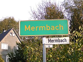 Place-name sign and homestead in Mermbach