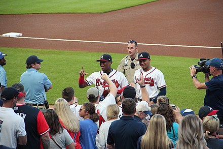 Ronald Acuña Jr. (left) and Johan Camargo (right) signing autographs, September 18, 2018