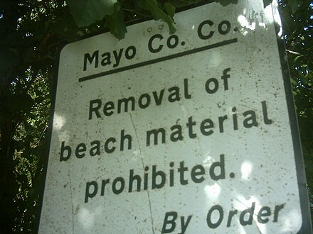 Sign in County Mayo, Ireland, forbidding the removal of sand and stones from a beach.