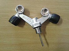 Slingshot valve with DIN connections has both a right and a left hand side spindle valve in the same body Slingshot scuba cylinder valve 20160618 140707.jpg