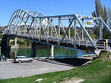 The 1958 steel truss arch bridge carrying State Highway 8 across the Clutha River at Alexandra State Highway 8 bridge Alexandra, New Zealand.jpg